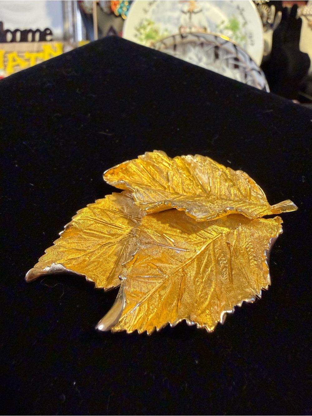 BSK-Leaf-shaped GOLD tone brooch likely a pin accessory